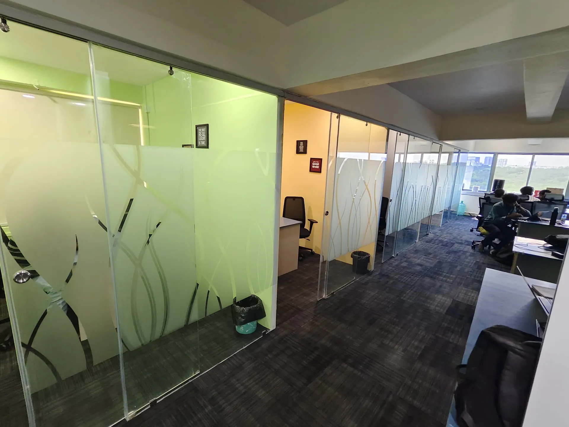 Slashnsap office hallway with garden-view windows